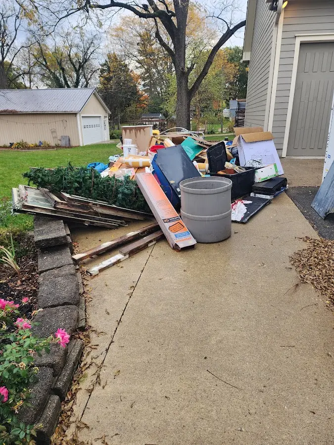 Dumpster being loaded with debris for Commercial Dumpster Rental in Ballston